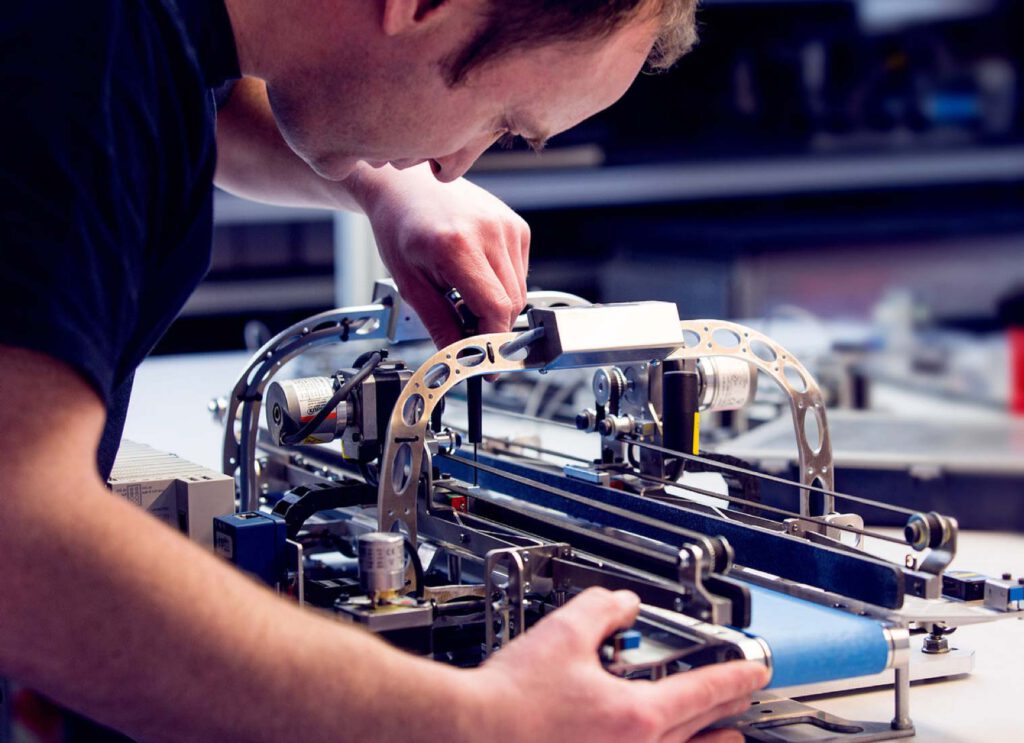 An expert is assembling one of our Meditech Pharma robots